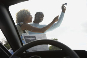 Happy couple with car purchase